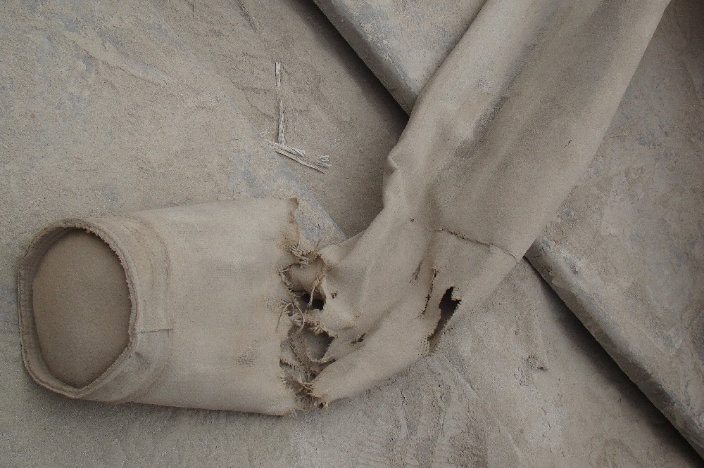 如何处理破损的除尘布袋？